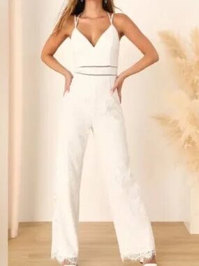 Lulus Always Love You white lace jumpsuit featuring a plunging V-neckline.